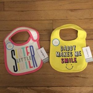 Two water resistant baby girl bibs NWT